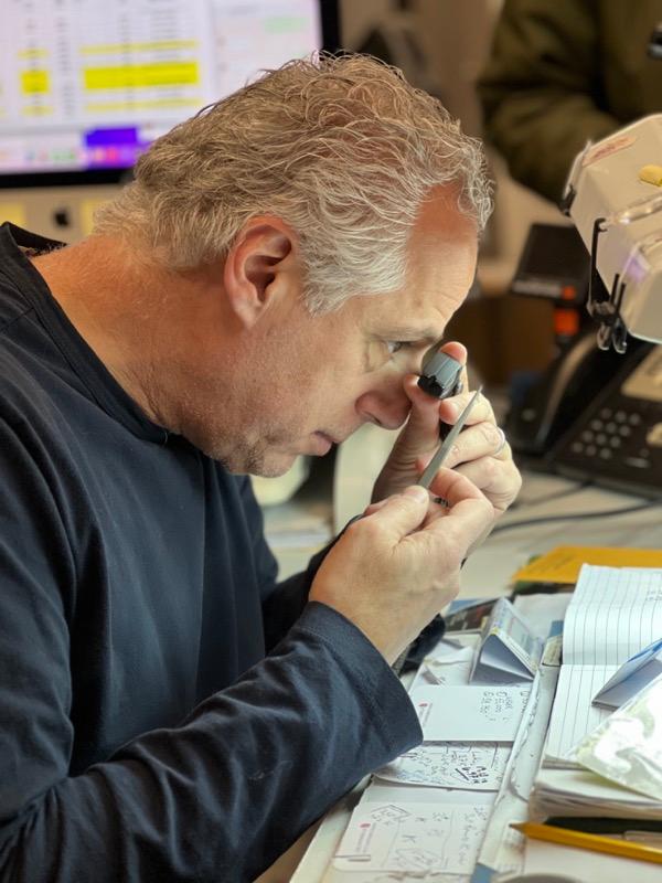 Rob Cornfield inspecting diamonds with loupe